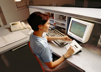 Photo of a woman sitting at a computer